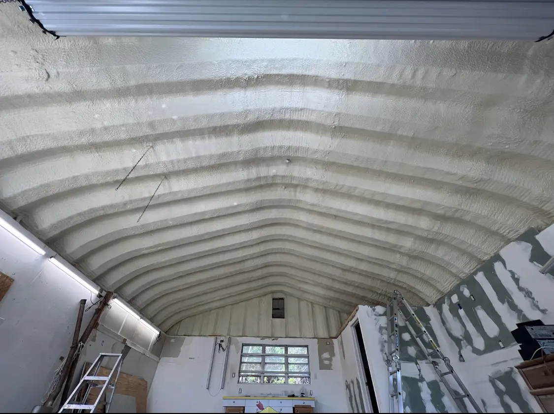 Spray polyurethane foam applied to the underside of a metal roof deck in Aiea